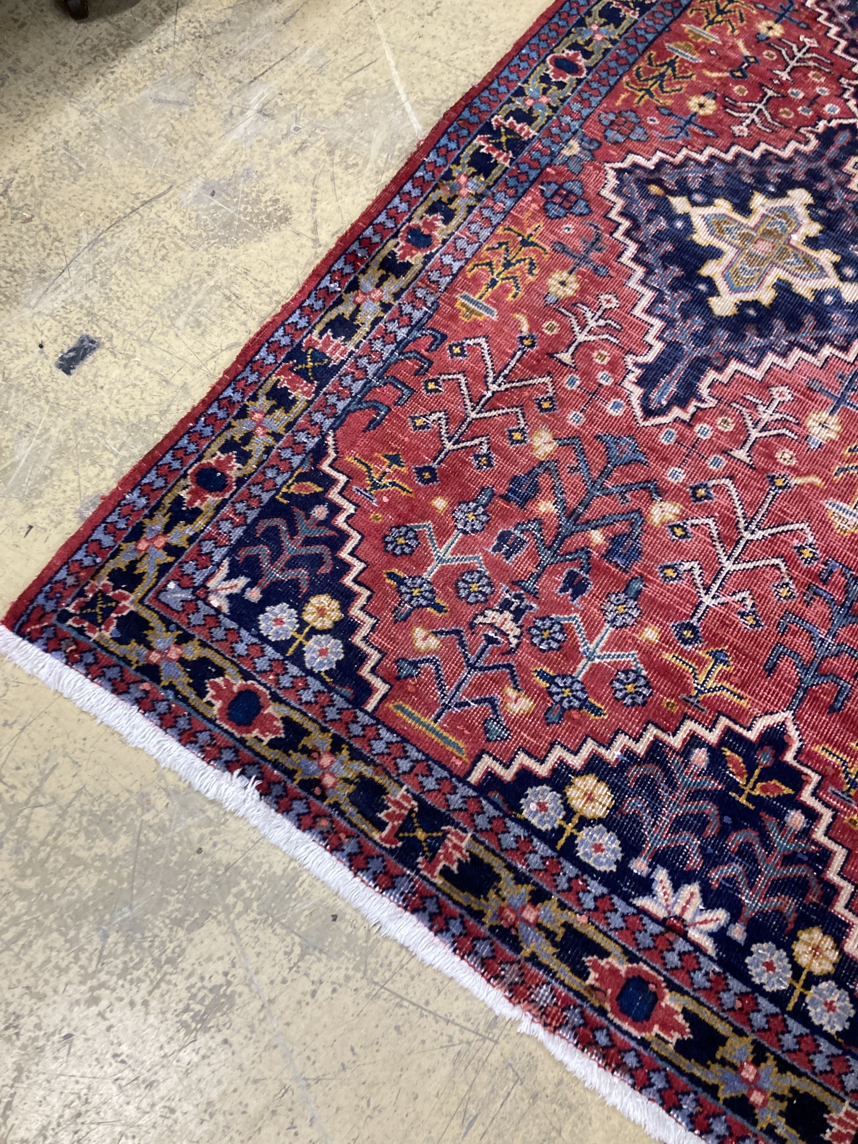 A Caucasian design red ground rug, 206 x 134cm together with a smaller West Persian design rug